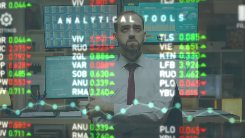 a man standing in front of a chart with numbers